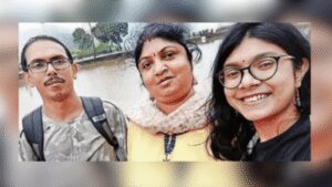 Anamika with her parents in a photograph from family album.jpg