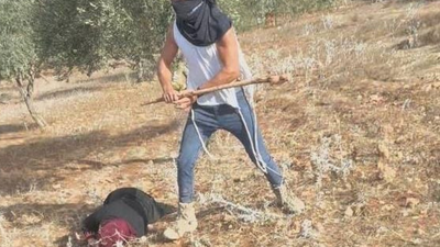 Struck over the head: Israeli settlers attack Palestinian farmers in West Bank; video captures assault on woman Image xabujomaagaza.jpg