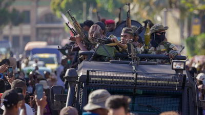 Military unit make their way to the presidency to make announcement ap.jpg