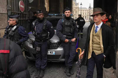 Police officers block an access to the louvre museum after a robbery sunday oct 19 2025 in paris ap photothibault camus.jpg