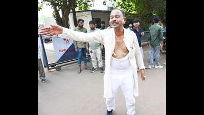 Rjd leader madan shah seeking a ticket from the madhuban seat breaks down outside the patna residence of former cm rabri devi tearing his kurta in despair.jpg