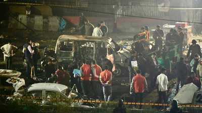 A powerful blast outside red fort metro station plunged the area into chaos with eyewitnesses describing deafening noise flying car parts and widespread panic.jpg