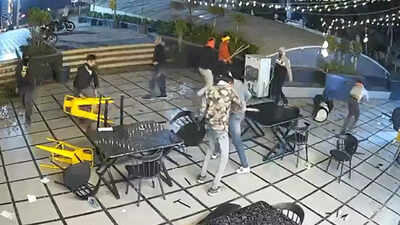 Masked assailants stormed a bhopal caf vandalizing furniture with swords and sticks in a swift violent attack.jpg