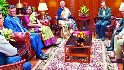 Members of the 16th finance commission led by chairman arvind panagariya with finance minister nirmala sitharaman after submitting its report to president droupadi murmu on monday.jpg