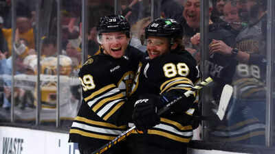 Morgan geekie with david pastrnak.jpg