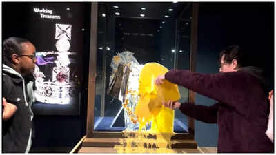 Activists just dumped apple crumble and custard onto the glass case holding the crown jewels at the tower of london.jpg