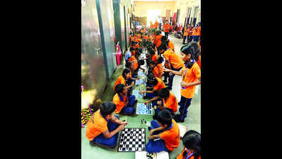 Class iii and iv students of vivekanand vidya mandir primary school keri play chess in the school corridor.jpg