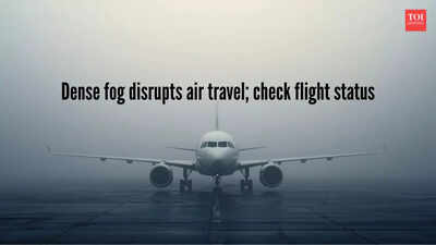 Plane on runway standing engulfed in fog and less visibility.jpg