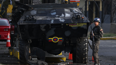 A member of the national guard stands guard at fuerte tiuna venezuela39s largest military complex in caracas after us strikes afp photo.jpg