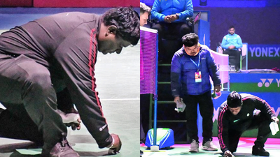 An official tries to clean the court after the incident in new delhi on thursday.jpg