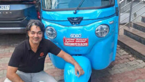 Rakesh with his auto.jpg