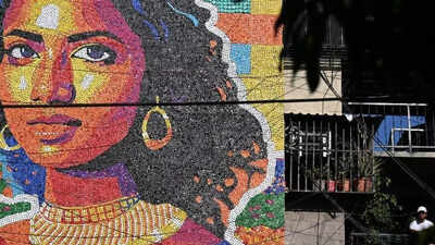 El salvadors mona lisa gets a colourful makeover in a 13metre mural made from recycled caps.jpg