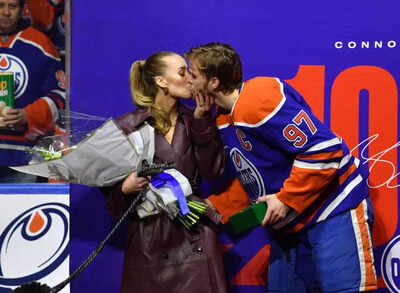 Nhl connor mcdavid of the edmonton oilers kisses his wife lauren kyle.jpg