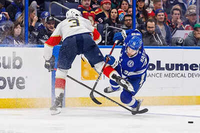 Nhl brandon hagel of the tampa bay lightning is hit by seth jones of the florida panthers.jpg