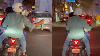 Three doctors celebrating their master of science in orthopaedics were booked for riding triple on a two wheeler with two not wearing helmets photo toi.jpg