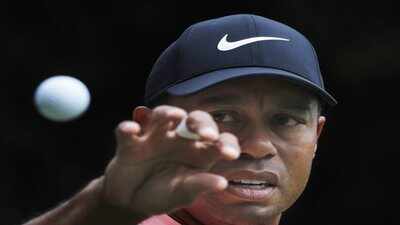 Mexico city tiger woods eyes a ball to catch that was tossed at him by his cadd.jpg