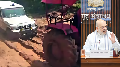 A car being pulled by a tractor amid poor road conditionsl union home minister amit shah r photo credit xamit shah.jpg