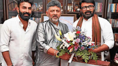 Na haris mla and son mohammed nalapad called on dk shivakumar and wished him for his birthday on friday shivakumar was also gifted a new yezdi roadster by a dealer.jpg