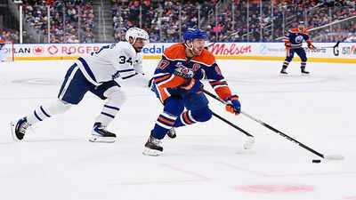 Nhl connor mcdavid 97 of the edmonton oilers skates against auston matthews 34 of the toronto maple leafs during a game at rogers place on february 3 2026 in edmonton alberta canada.jpg