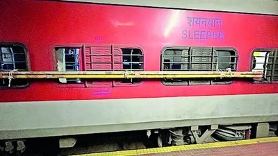 Rpf personnel at rajahmundry cut off ropes that secured the poles to the train compartments windows.jpg